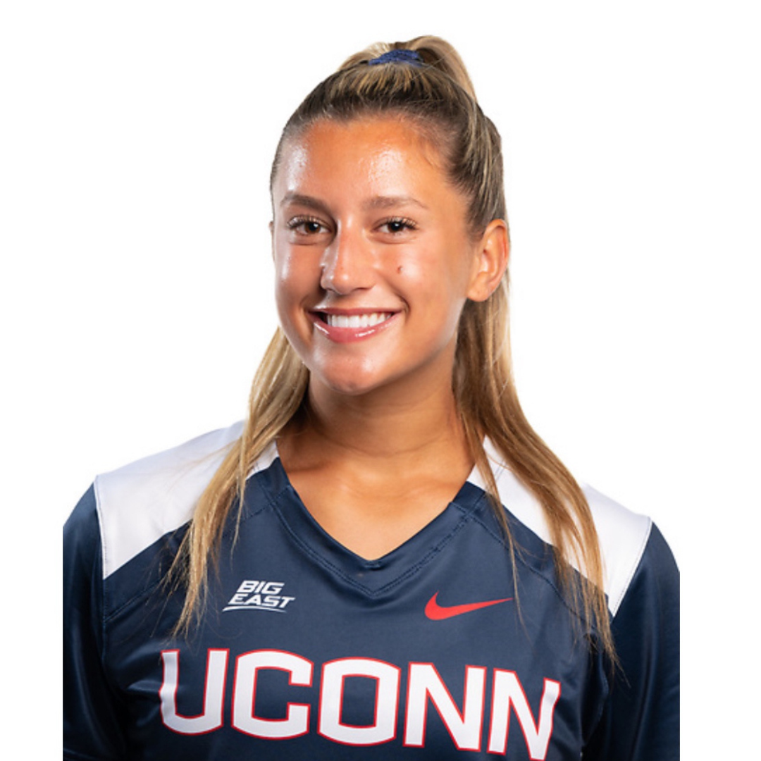 Smiling woman in a UConn athletic jersey against a white background.