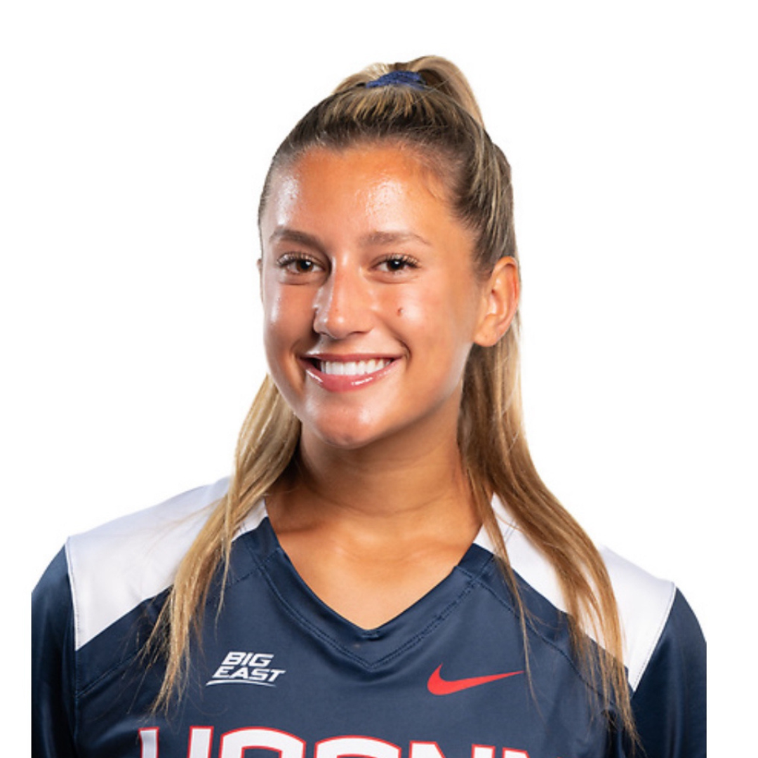 Smiling woman in a UConn athletic jersey against a white background.